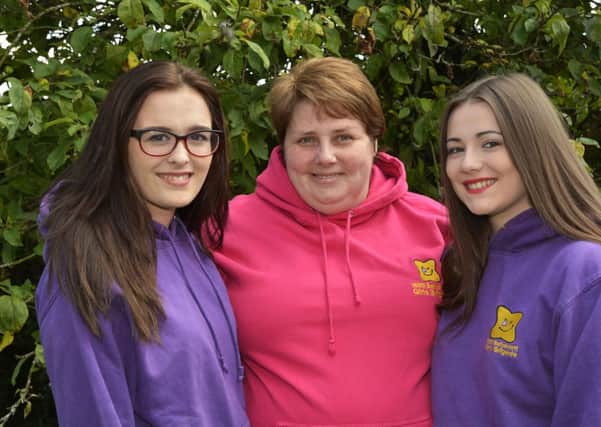 Linda Gardiner, Company Captain, pictured with 168th Ballyarnett Girls Brigade members Chloe Cole, left, and Chloe Robb, who will be travellingt to Tanzania on Friday. INLS3014-101KM