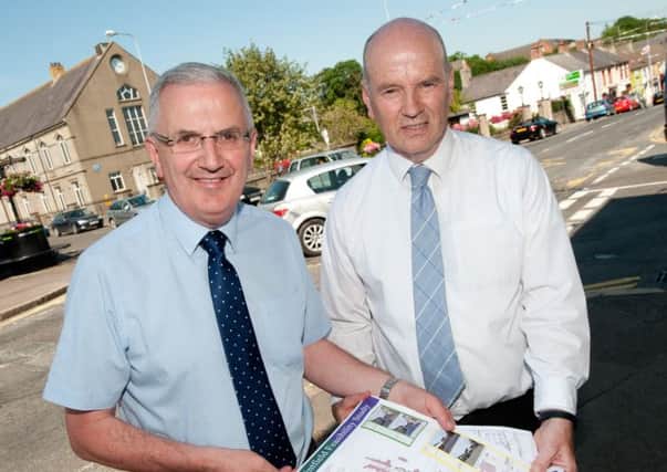 Transport Minister, Danny Kennedy with Stephen Duffy, from Transport NI pictured on Main Street, Saintfield where work is set to begin on a £200,000 road improvement scheme.
