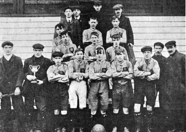 Harryville FC with the McClure Cup, 1907-07. Front row: J. Barr, M. Killough, t. Patterson, N. Smyth, W. Craig, S. McNabney, T. Woodcock, T. Killough, H. Fisher. Second row: J. Beggs, S. McAllister, R. Heggarty. Third row: A. Wallace, W. O'Hara. A. Gettis. Back row: J. Boyle, A. Kirkpatrick. W. O'Loan and W. Leetch. INBT25-764F
