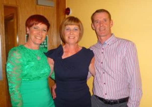 Aileen, Mairead and Sean at their 50th birthday party.
