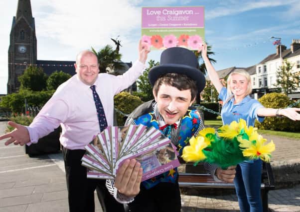 Visitors to Craigavon are sure to feel well and truly loved this summer as theyll be treated to an exciting schedule of free entertainment in Lurgan and Portadown town centres every Saturday until 30th August, as well as vouchers for lots of goodies to spend in local coffee shops, restaurants and visitor attractions. Councillor Mark Baxter celebrates at the launch of the Love Craigavon schedule with magician Colm Fitzpatrick who will wow shoppers with his magic tricks alongside U105 street team member Kiera Gormley who will be on hand to give out vouchers to lucky passers-by.  For more information visit www.discovercraigavon.com