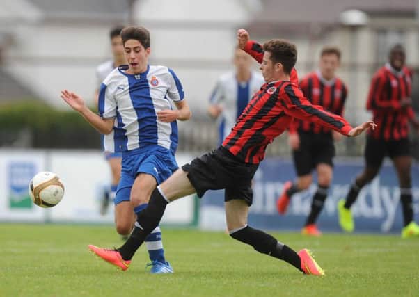 Premier Section: Espanyol's Sanchez Poves and Cherry Orchard's  Sean Gilbert during this evening's  game at the Ballymena Showgrounds Photo Colm Lenaghan/Pacemaker Press