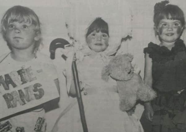 Taking part in the fancy dress parade at Carrickfergus Festival  in the summer of1987 are Janis Irvine as 'Smartie-Pants', Jaclyn Stewart as 'Little Bo-Peep' and Claire McIlveen as a 'Spanish Doll'. INCT 32-703-CON