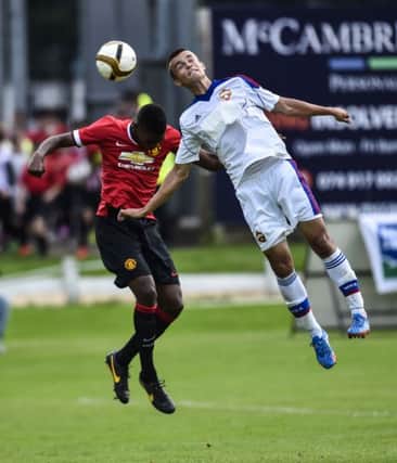 Man Utd's Ro-Shaun Williams and CSKA Moscow's Ferapontiv Lilia in action at Wednesdays Game. ©Russell Pritchard / Milk Cup