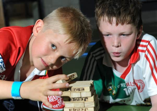 Michael and Daniel enjoy a game of Jenga during the Summer Scheme at Cookstown Leisure Centre.