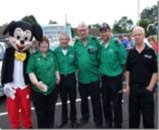 St John Ambulance pictured with Mickey Mouse at the recent Dervock Festival of Running. inbm32-14.