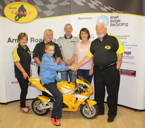 Congratulations to Owen Maybin, from Ballycastle, who has won the Mini-Moto from the AMRRC Supporters Club Competition! Pictured with Owen are his parents, Selma McMullan and Yolande O'Kane from the Supporters Club and Gerry Dallat, who kindly donated the Mini-Moto. INBM32-14