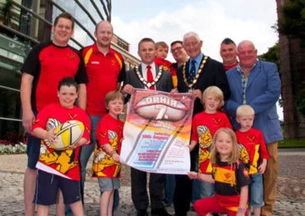 Launching the upcoming Ophir Rugby Annual 7-a-side tournament are Mayor of Newtownabbey Alderman Thomas Hogg, Deputy Mayor of Newtownabbey Alderman Pat McCudden and Ophir RFC President Martin Morrison (far right) pictured with (back row) Robert and Jonah Press, Gavin Robinson; (mid row): Neal Gray, Will Lucas; and (front row) Daniel Robinson, Ethan Lucas, Seth Lucas, Daniel Gray, and Hannah Press. INLT 32-901-CON