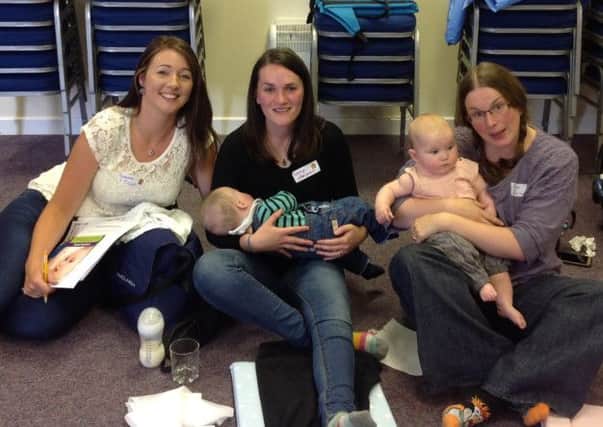 Gemma, Caryn and Benjamin and Clare and Grace taking part in the Baby Massage course at Carrickfergus Baptist Church. INCT 32-706-CON