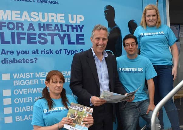 North Antrim MP Ian Paisley who last week visited the Diabetes UK Care and Connect Campaign Roadshow, at Tesco Ballymena, is seen here with Diabetes UK Volunteers, Danielle Campbell Joji Min and Lucia Dunn. INBT 32-101JC