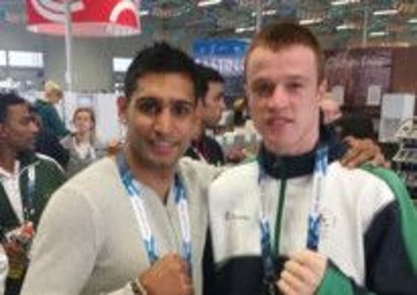 Steven Donnelly pictured with one of his boxing heroes Amir Khan at the Commonwealth Games.