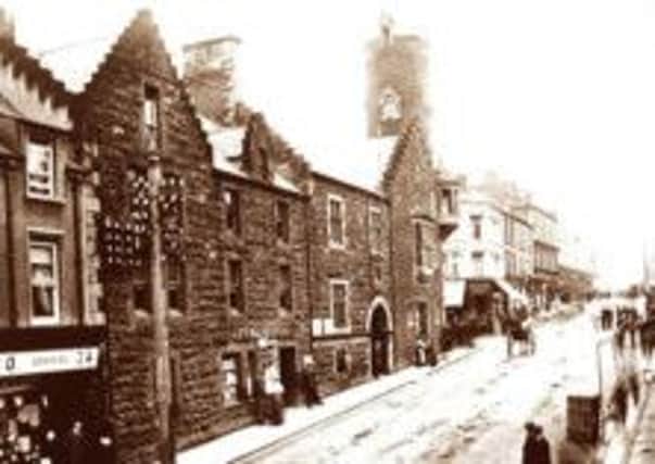 A classic view, looking up Bridge Street at Ballymena's Old Town Hall. This picture was taken in the first two decades of the 20th century before the original town hall was destroyed in a fire.