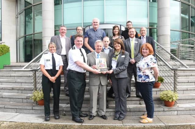 Councillor Brian Bloomfield, Chairman of Lisburn PCSP launches the Code of Practice for Off-Licences with members of the PSNI, PCSP and off-licence premises at Lagan Valley Island.