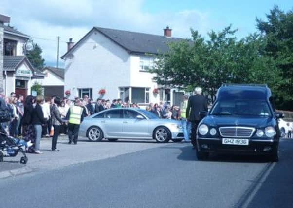 Hundreds gather outside the Church of St John the Baptist in Galbally for Rosaleen Donaghy's funeral
