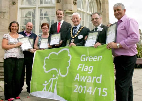 Pictured picking up the seven prestigious Green Flag Awards presented to Newtownabbey Borough Council at Stormont Estate are (l-r) Lindsay Houston, Biodiversity Officer; Mark Wilson, Central Services Team Leader; Linda Dodds, Ballynure District and Community Association; Mark H Durkan, Environment Minister; Deputy Mayor of Newtownabbey Alderman Pat McCudden; Hugh Kelly, Assistant Chief Executive; and Ken McFall, Carnmoney Cemetery.