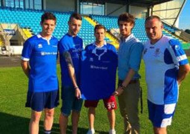 Johnny Small, of Style N Sport, presents a kit to Jason Connolly, to be worn by the Ballymena Saturday Morning League Select team in Monday night's charity fixture against Ballymena United. Also included in Sky Blues manager Glenn Ferguson.