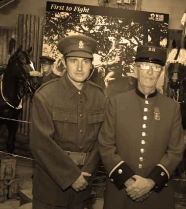 AT EASE. Chelsea Pensioner Sam Cameron and Darren Purdy from the War Years Remembered, pictured at the WW1 Commemoration Weekend on Friday.INBM32-14 027SC.