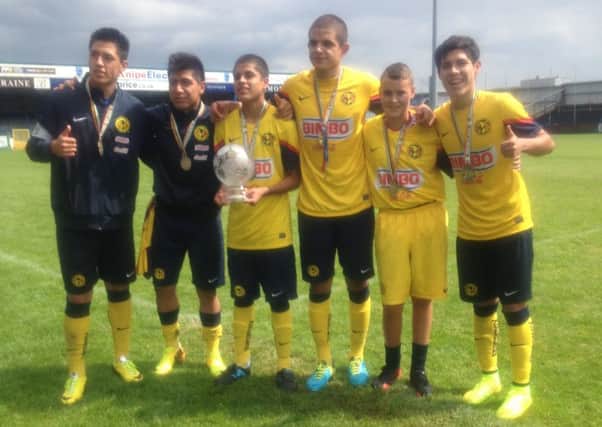 Northend United U15s captain, Aaron Campbell, who won a local competition to train all week with the Club America de Mexico at the Dale Farm Milk Cup. The team were the eventual winners of the Milk Cup Globe final.