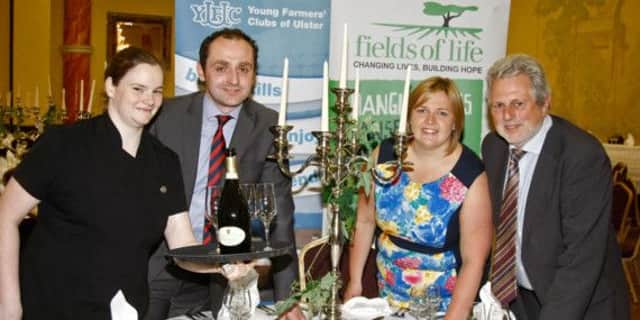 Pictured preparing for the dinner is YFCU President Martyn Blair, left), Janette Stirling, YFCU Vice President and Dolway Johnston (right) from Fields of Life charity, with Patricia from the Tullyglass Hotel.