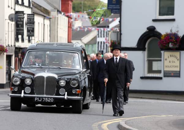 The funeral cortege makes its way through Dromore, Co. Down