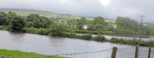 GO WITH THE FLOW. The flooded fields near Magherahoney on Saturday. Some residents claimed that it was the worst they can remember.INBM32-14 048SC.