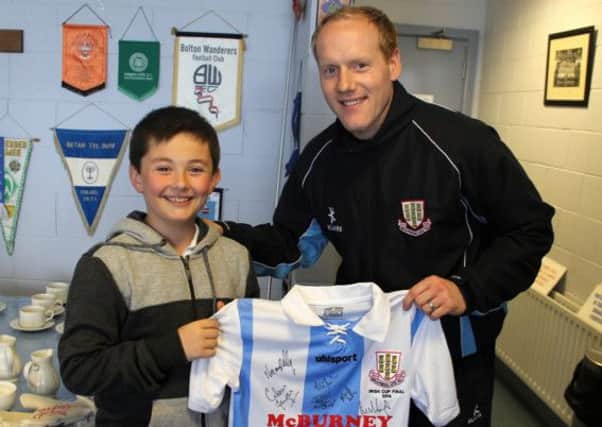 Junior Sky Blues member Gareth Walsh, who was the lucky winner of a signed Irish Cup Final shirt, pictured with goalkeeper Dwayne Nelson.