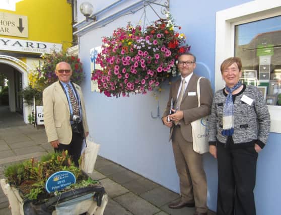 Britain in Bloom judges Jon Wheatley and Darren Share with Alderman May Beattie at The Courtyard, Carrickfergus. INCT 32-791-CON