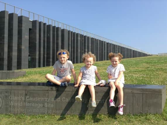 The Cassidy family - Dylan, Ava and Ella - enjoying a day out at the Giants Causeway Visitor Experience.