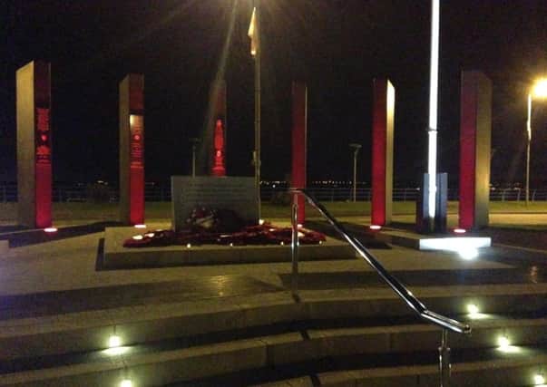 Carrickfergus Cenotaph illuminated in red to mark the WWI centenary.  (Photo by Andrew Wilson)   INCT 32-730-CON