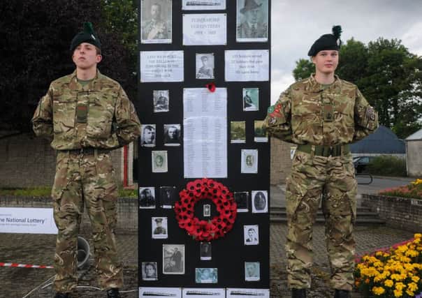 Standing tall at the Role of Honour at the Service of Remembrance in Tobermore on Monday evening, as they commemorate the 100th anniversary of WW1.