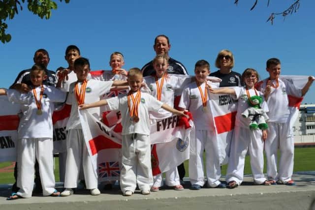 The Tae Kwon Do class at the Jethro Centre. Back Row: Adrian Morton, Al-Noor Tuansi, Ben Mc Cone, Leo Maguire, Sarah Seawright.
Front Row: Sam Best, Cody Fyffe, Jay Fyffe, Rachel Mc Cune, Pearse Dunlop, Rebecca Mc Cune and Aaron Mc Shane.