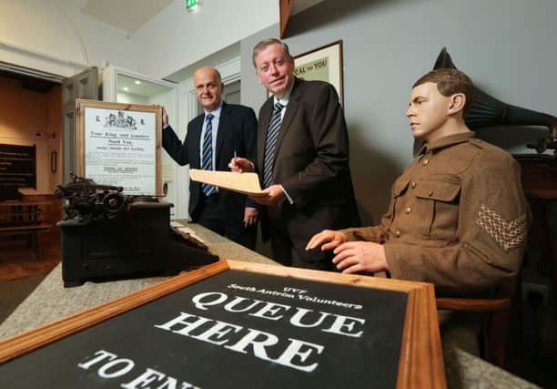 Alderman Paul Porter, Chairman of the Council's Leisure Services Committee and Mr Jim Rose, Director of
Leisure Services visit the 'Recruitment Desk' to launch the 'Lisburn 1912-1914' exhibition at the Irish Linen Centre and Lisburn Museum.