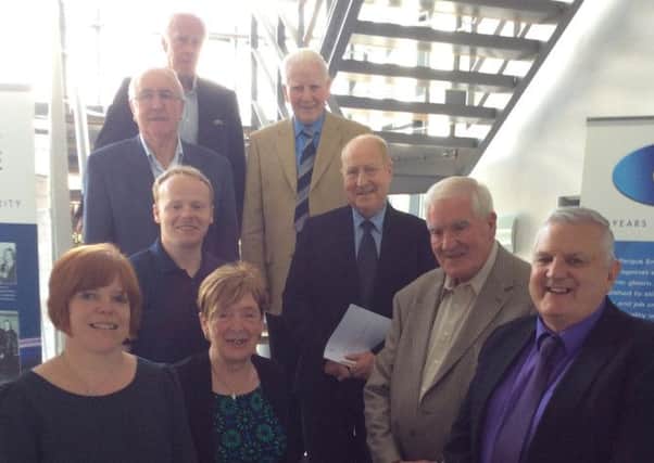 Billy Adamson (front right) and colleagues at the annual general meeting of Carrickfergus Enterprise. INCT 33-750-CON