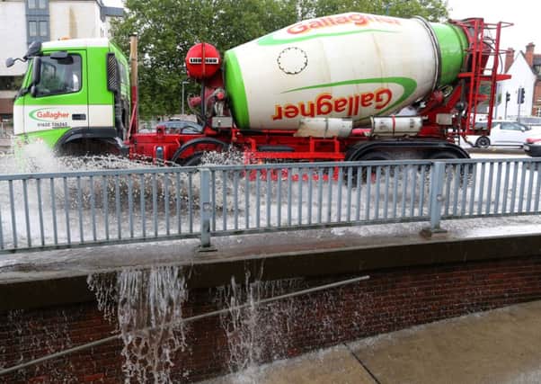 A lorry passes through a flash flood following a heavy rain shower in Maidstone, Kent. PRESS ASSOCIATION Photo. Picture date: Friday August 8, 2014.