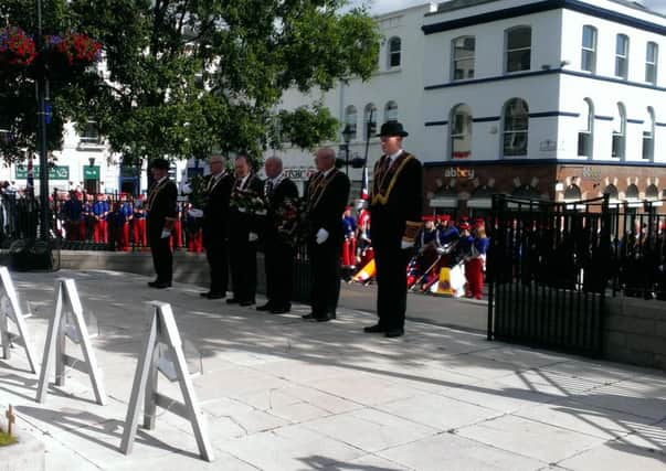 The senior officials from the General Committee of the Apprentice Boys of Derry, and guests, lead the Act of Remembrance, Silence and Salute at the War memorial in The Diamond.