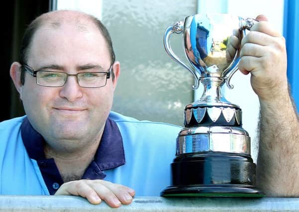 Ballymena bowler Andrew Morrison with the PGL Singles trophy he won last week. INBT 33-854H