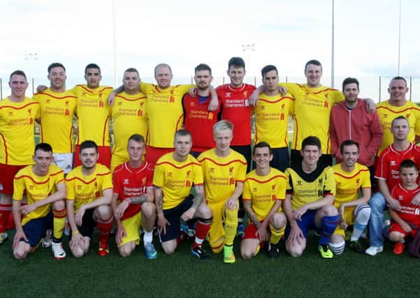 Members of the Ballee Liverpool Supporters Club pictured prior to their game with the local Manchester United supporters club, raising money for Spina Bifida. INBT33-231AC