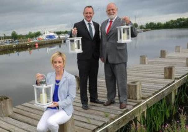 Lough Neagh Partnership's Eimear Kearney is joined by Liam Glavin, Head of Leisure Services at Cookstown council, and right, Cáthal Mallaghan, Vice-chairman at Cookstown council, to launch this years Festival of Lights and Water