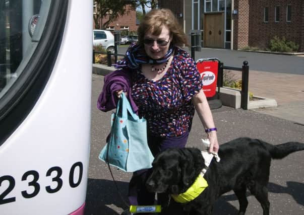Visually impaired artist Mary Kparka with guide dog Quiz. INNT-33-716-con