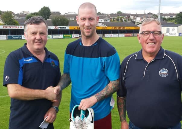 Institute striker Stephen O'Flynn picked up the Institute Supporters man of the match award, after their game against Dungannon Swifts. Also pictured are Ian Culbert (left) and Ivan Rutherford.