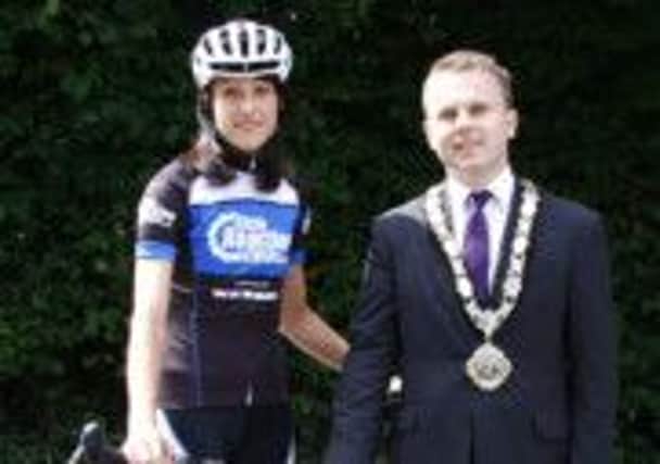 Newtownabbey Mayor Thomas Hogg pictured with Glengormley's Amy Brice who is undertaking a long-distance cycling event, the Haute Triple Challenge, across the Dolomites-Swiss Alps. INLT 33-921-CON