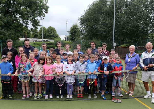 8 to15 year olds who took part in the Ballymena Tennis Club summer fun week at the People's Park are seen here with Mayor of Ballymena Cllr Audrey Wales, club chairman Fergus Barklie and club coaches. INBT 33-171CS