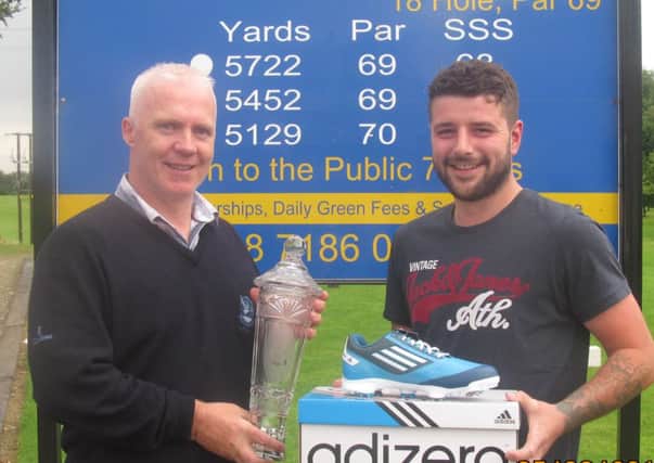 Robert Curry (Faughan Valley Club Captain) presents Robert Mitchell Winner of the Ronnie Ross Trophy Sponsored by Eakin Bros..