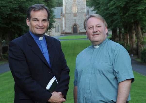 The Rev Mike Dornan, Curate (right) and the Rev Dr Bryan Follis, Rector (left) pictured against the backdrop of the historic Parish Church of St Malachys, Hillsborough.