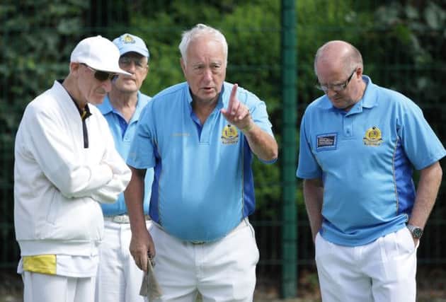 Guiding the bowls in during Saturday's match between Lisnagarvey and Antrim, at Warren Gardens. US14-508cd  Picture: Cliff Donaldson