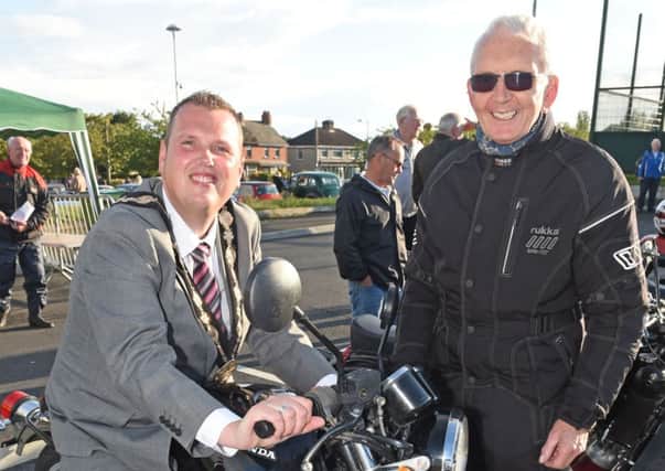 The Mayor of Lisburn, Councillor Andrew Ewing at the Vintage and Classic Car and Bike event with Drew Mansell held at the LeisurePlex to mark the start of UGP Bike Week 2014.