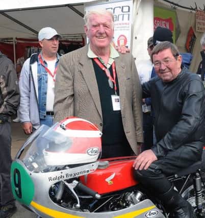 1965 World Champion rider Ralph Bryans, who died on Wednesday August 6, in August 2012 prior to taking part in a Parade Lap of the famous Dundrod circuit, one of several events celebrating 90 years of the Ulster Grand Prix. Included is Jim Lilley from Ballygowan, owner of the bike which Ralph rode in the 1960s.