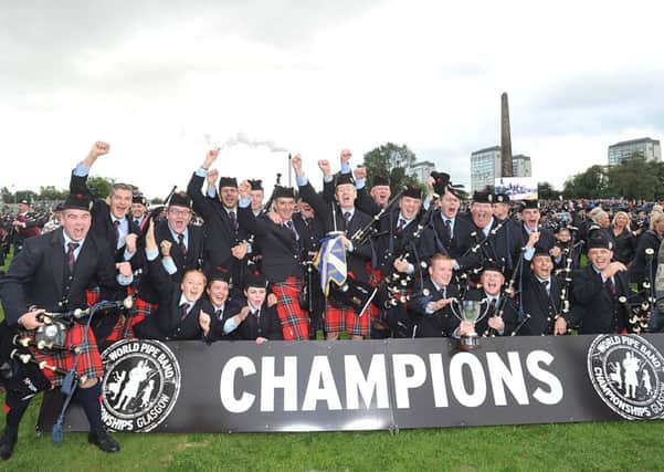 Field Marshall Montgomery are pictured as they were named World Champions for the third year in a row in 2013, making them the most successful pipe band of all time.