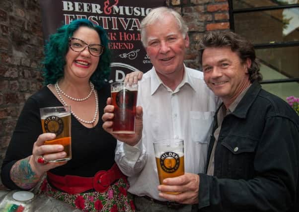 At the launch of the festival in Molly's Yard, Belfast is singer Kaz Hawkins, who will perform at the festival, Seamus Scullion, founder of the Hilden Brewery and Kevin Breslin from the Kaz Hawkins band.