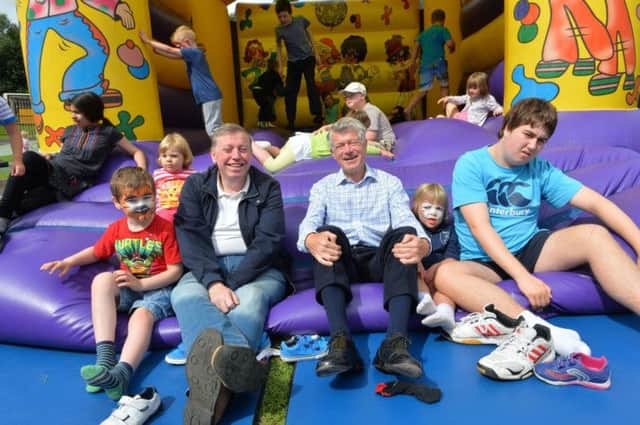 Alderman Paul Porter, Chairman of the Council's Leisure Services Committee and Mr Lawson McDonald, SEELB Commissioner are pictured with some of the participants at the Parkview School Fun Day as part of its summer scheme.